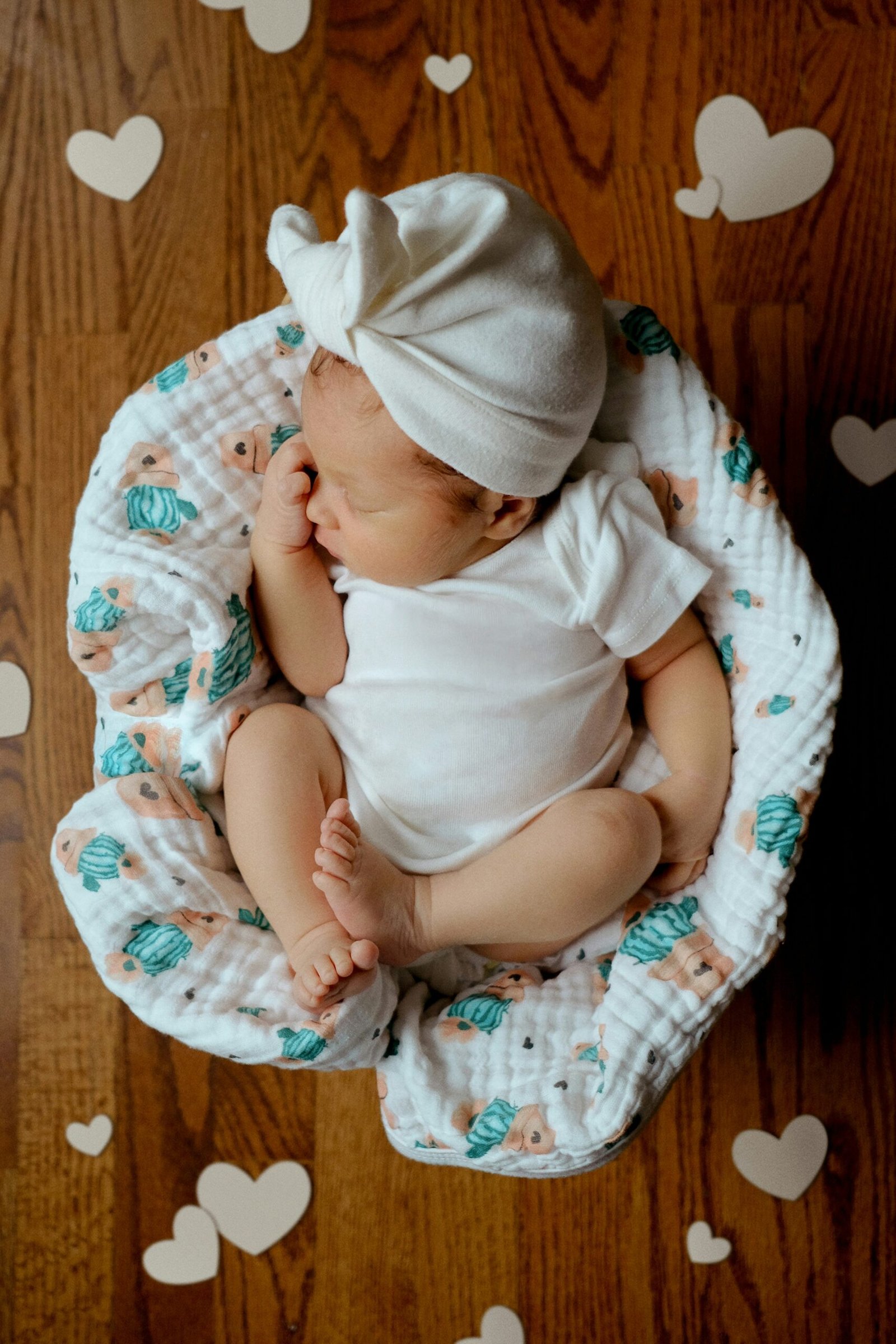 a baby sleeping on a blanket