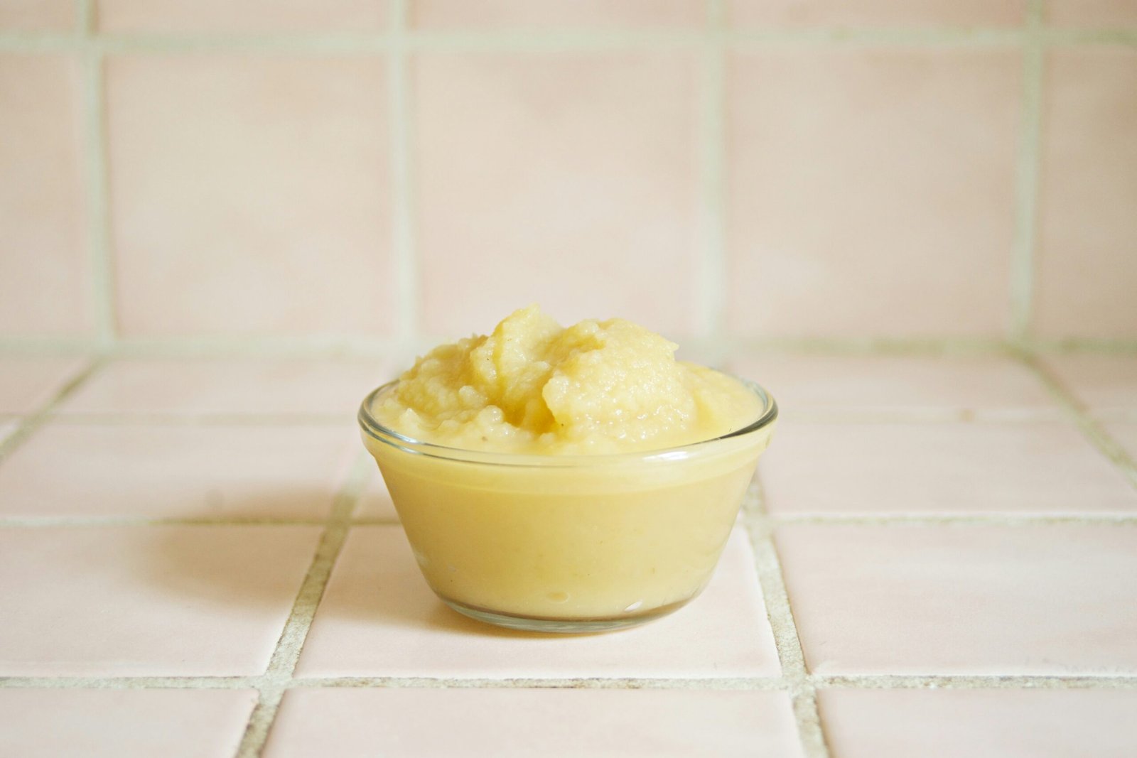 yellow cream in clear glass bowl